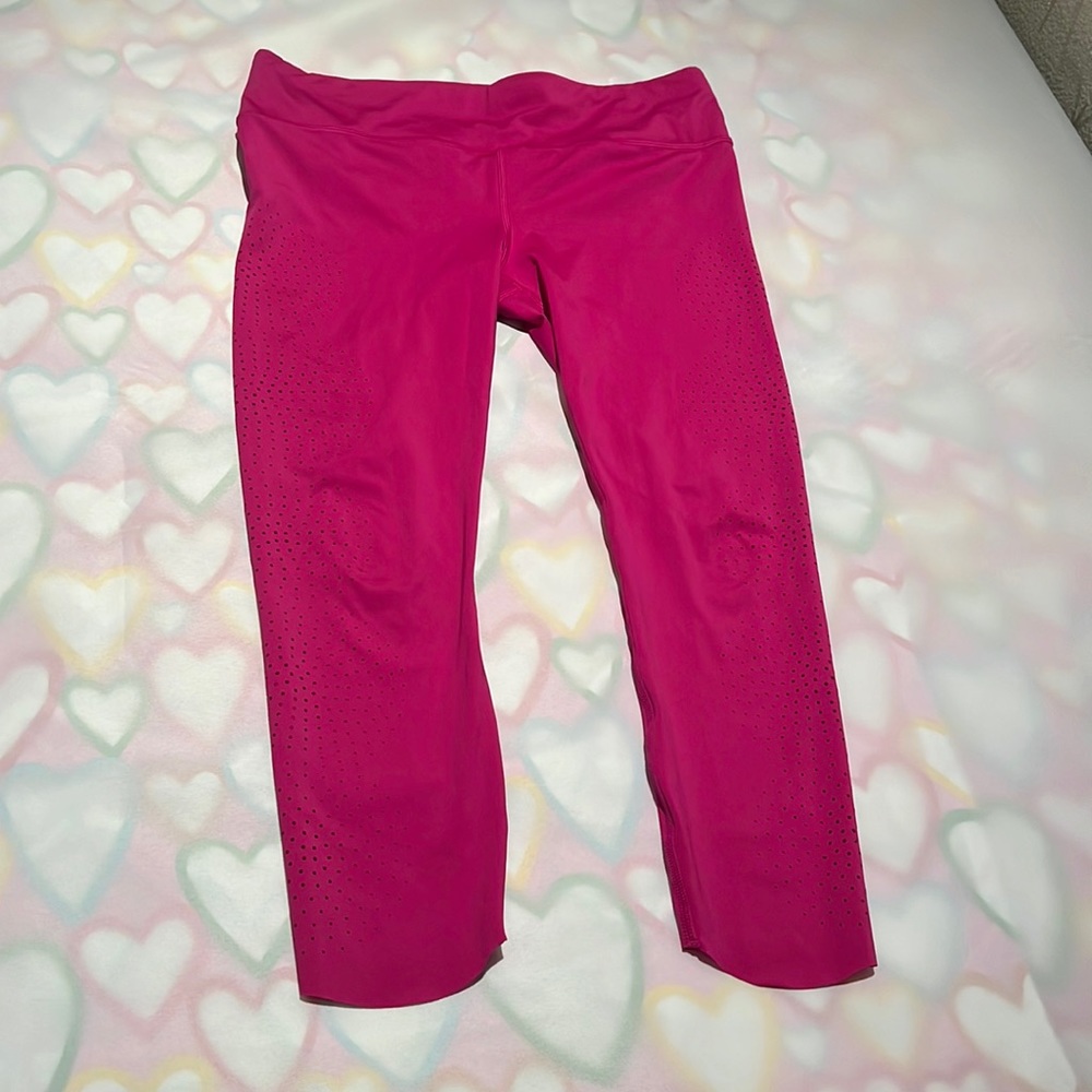 Pristine Athleta leggings with laser cut holes